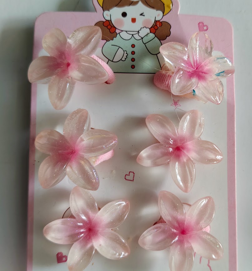 Accessoires cheveux fillette élastiques et barrettes fleurs